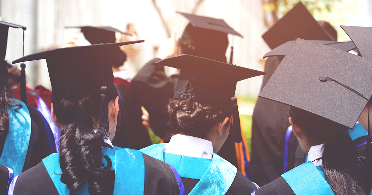 Group of college graduates shown from behind