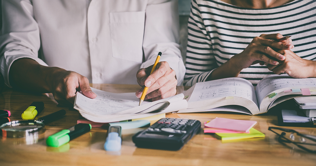 Tutor helping student with mathematics