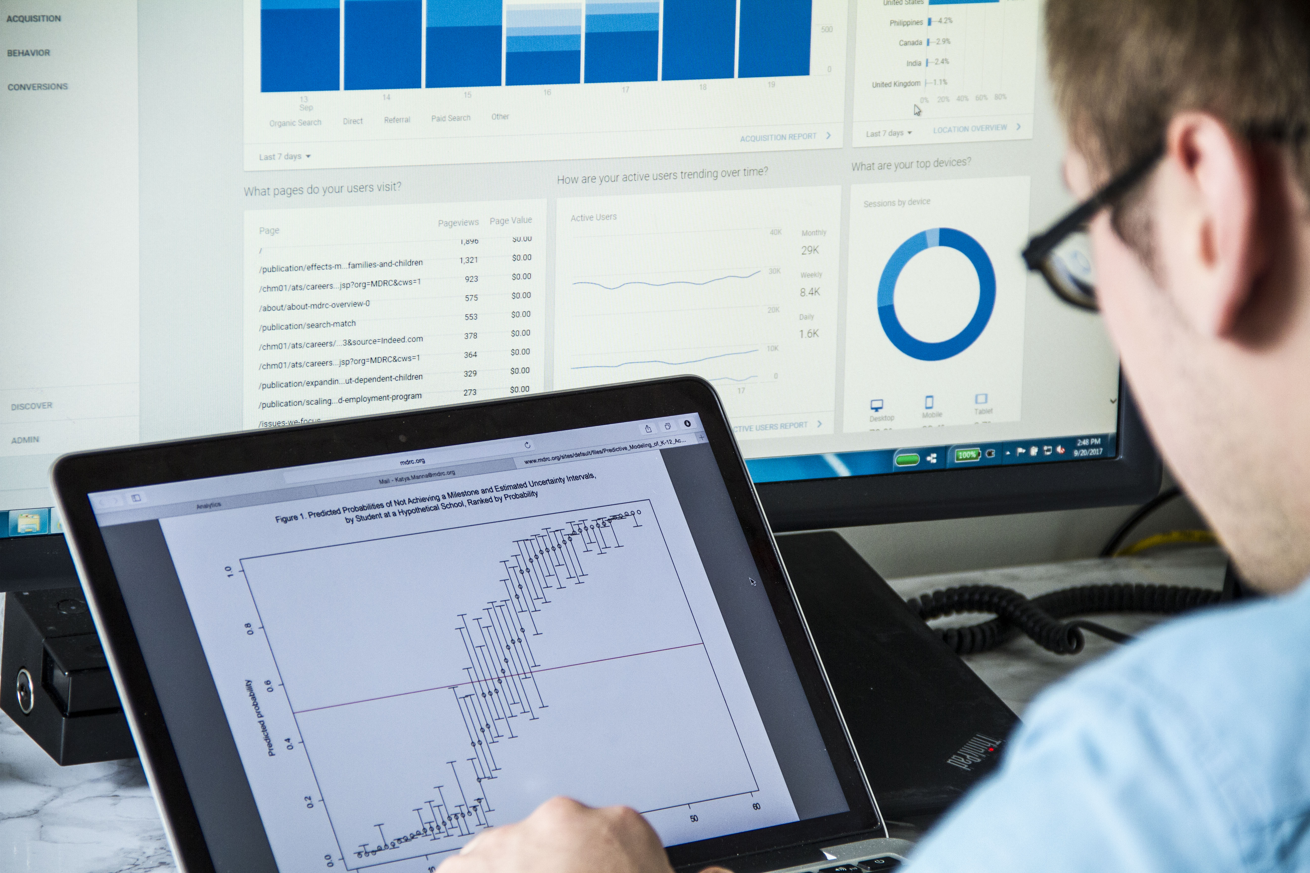 Man looking at a chart on a tablet