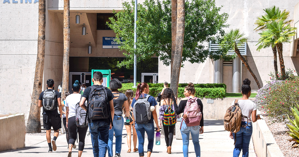 Group of college students walking on campus