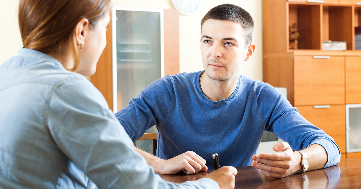 Man speaking with counselor