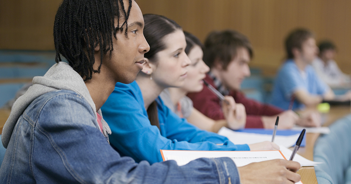 students in front of laptops