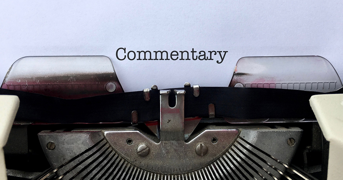 Paper in typewriter that reads Commentary