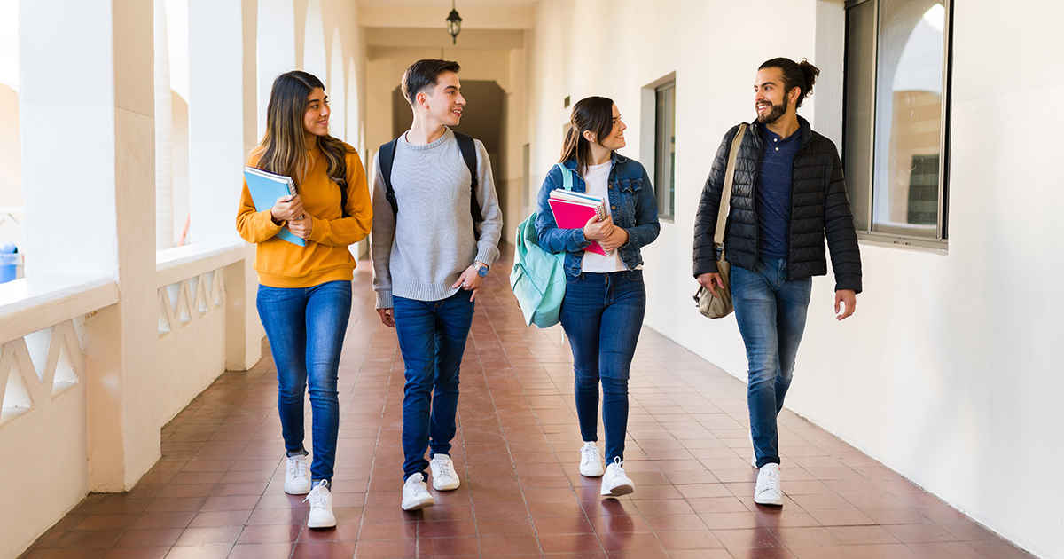 Diverse group of college students walking together