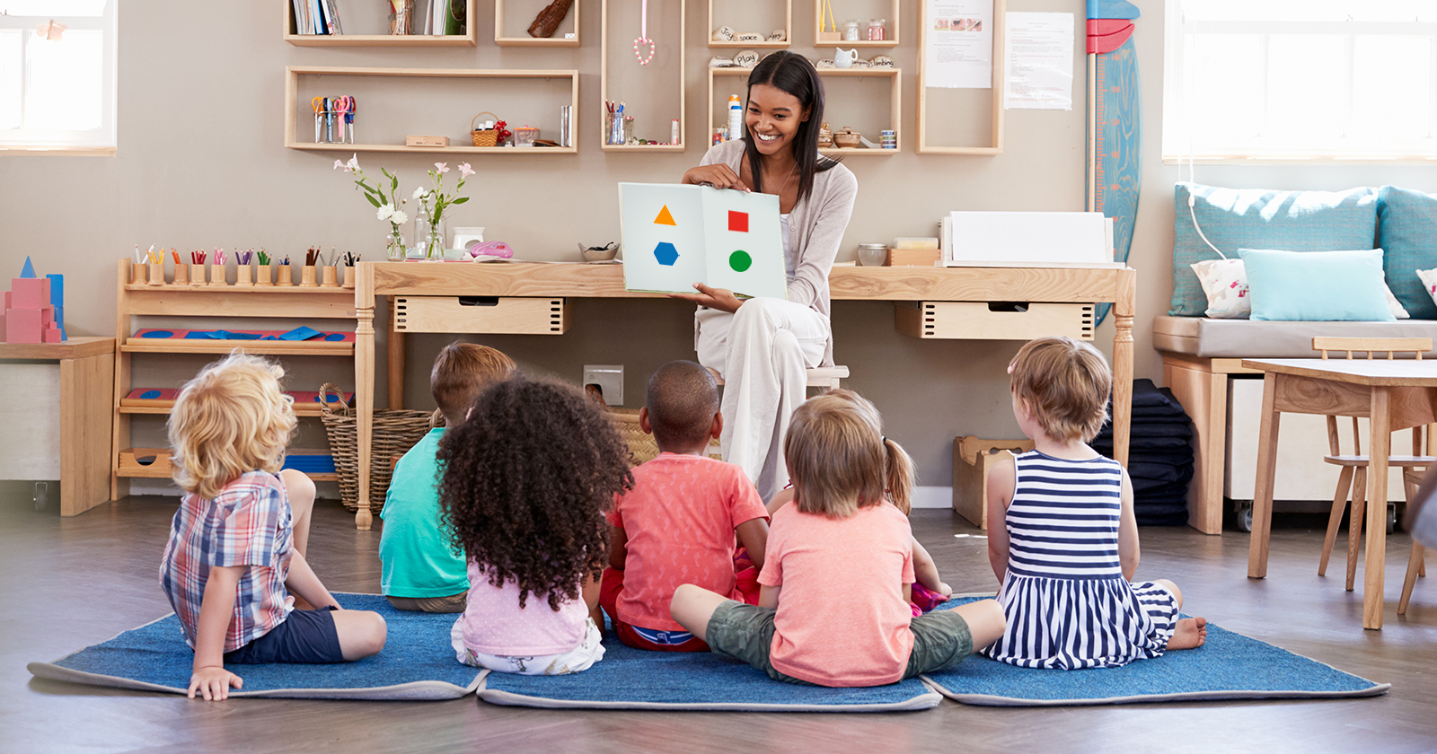 Teacher talking about shapes with pre-k students