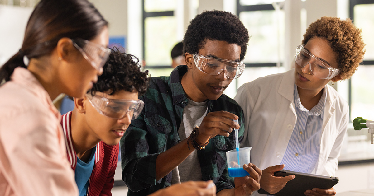 High schoolers working on a science experiment