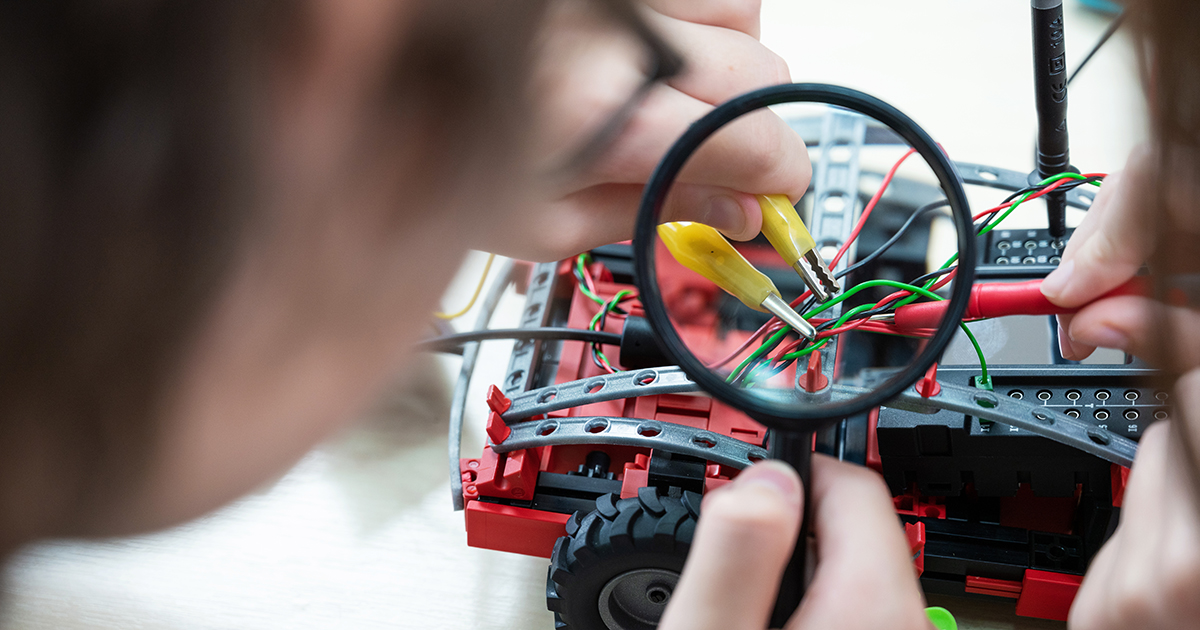 High school students working on a circuitry project