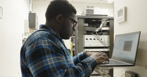 a man fixing a computer