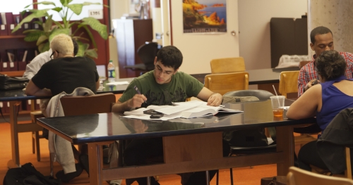 a student is studying in college library