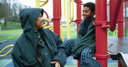 Black mom and son at a playground