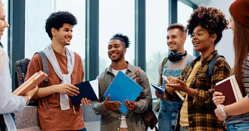 Diverse group of college students chatting