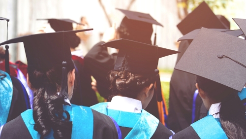 Group of college graduates shown from behind