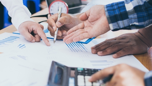 Hands of a diverse group of people having a meeting