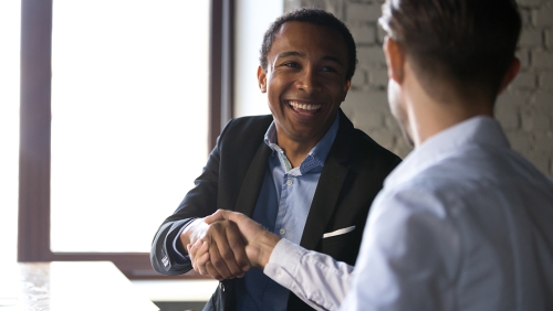 Job candidate shaking hands with interviewer