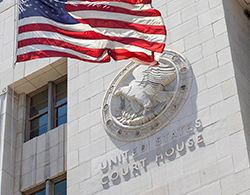 United States court house with American flag waving