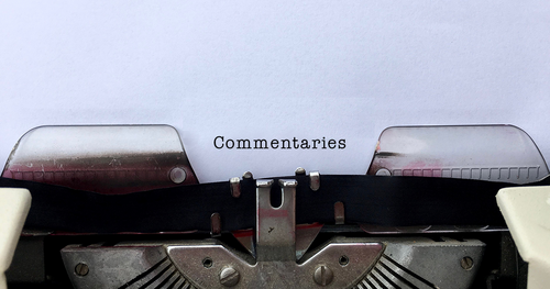 Paper in typewriter that reads 'Commentaries'